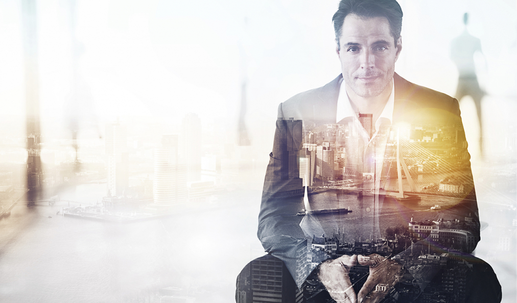 Graphic overlay of a man in a suit with picture of a cityscape layered on top