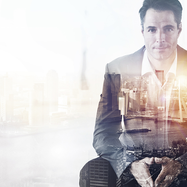 Graphic overlay of a man in a suit with picture of a cityscape layered on top
