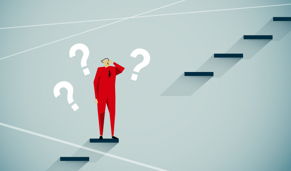 Graphic of a businessman in a red suit surrounded by question marks - which way next?