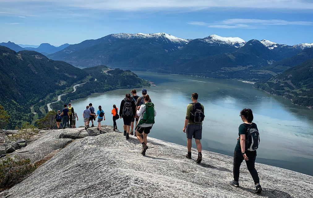 Group of Canadian youngsters hiking in the mountains