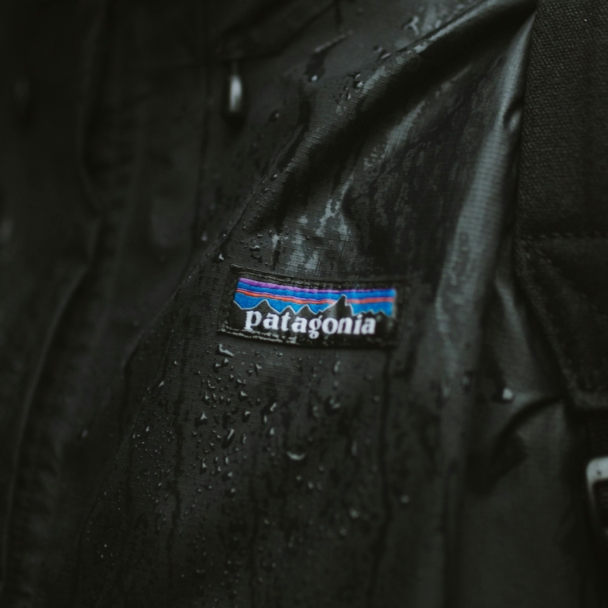 A black jacket featuring the Patagonia logo